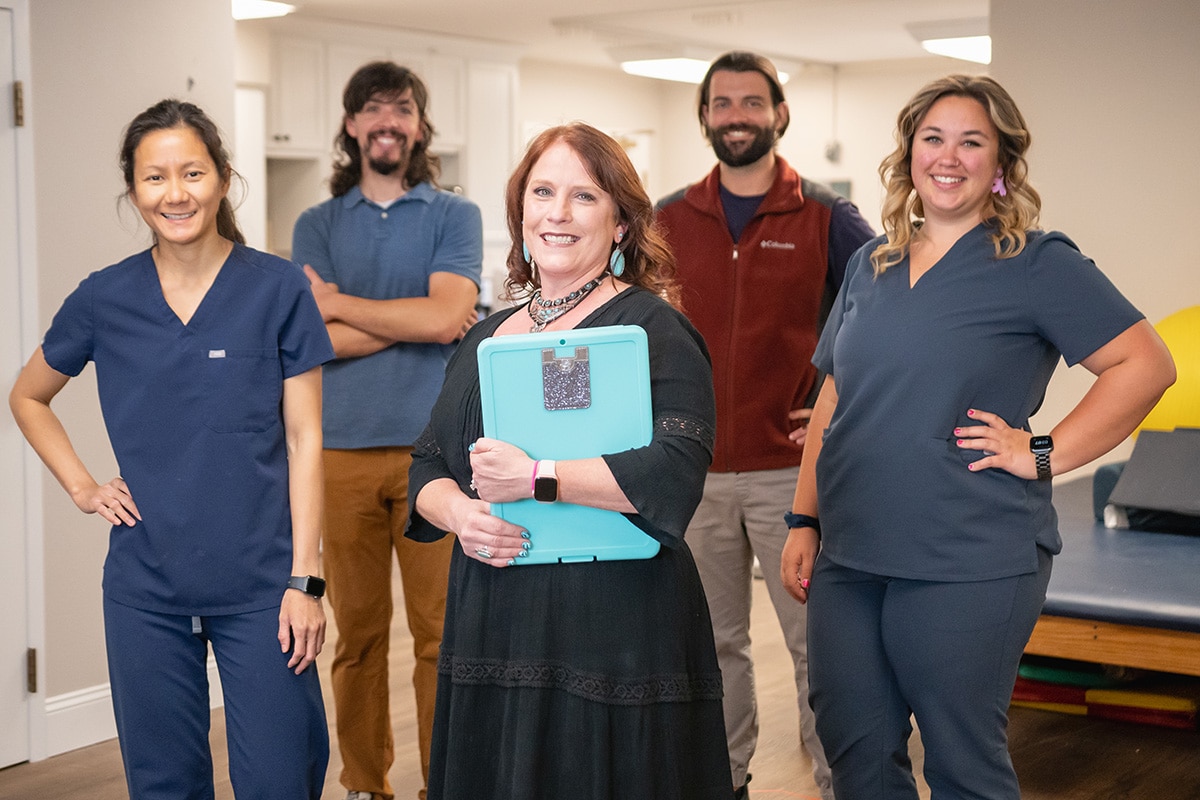 several nurses in the hallway of Arbor Post-Acute