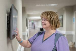 a nurse in the hallway at Arbor Post Acute