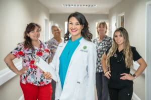 several nurses in the hallway of Arbor Post-Acute