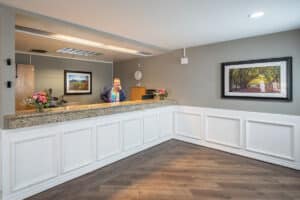 front reception desk and receptionist at Arbor Post Acute