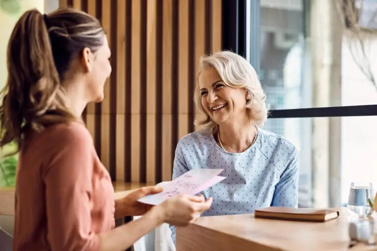 Staff member giving patient a card